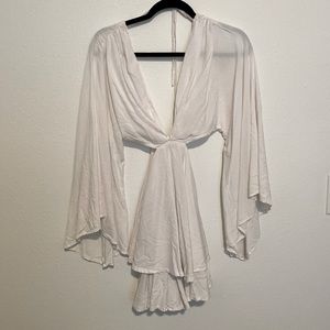 White flows beach dress with cut out sides